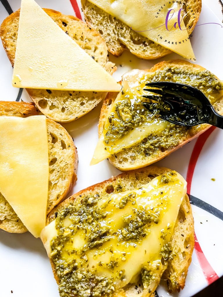 Spread Pesto onto Softened White Cheddar to Make Copycat Dunkin' Tomato Pesto Grilled Cheese Recipe